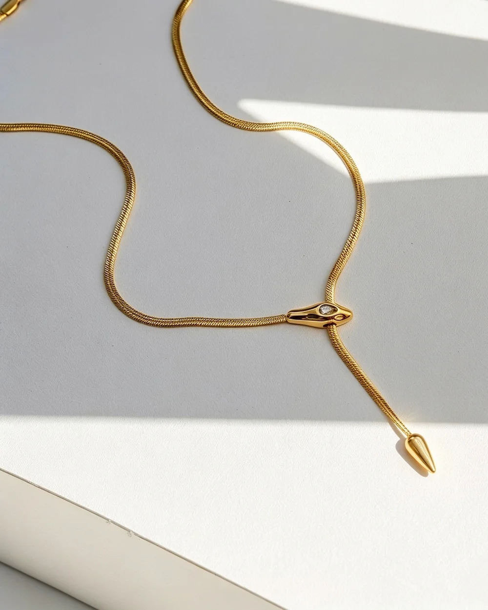 The Serpentine Lariat Electroplated Necklace in Gold